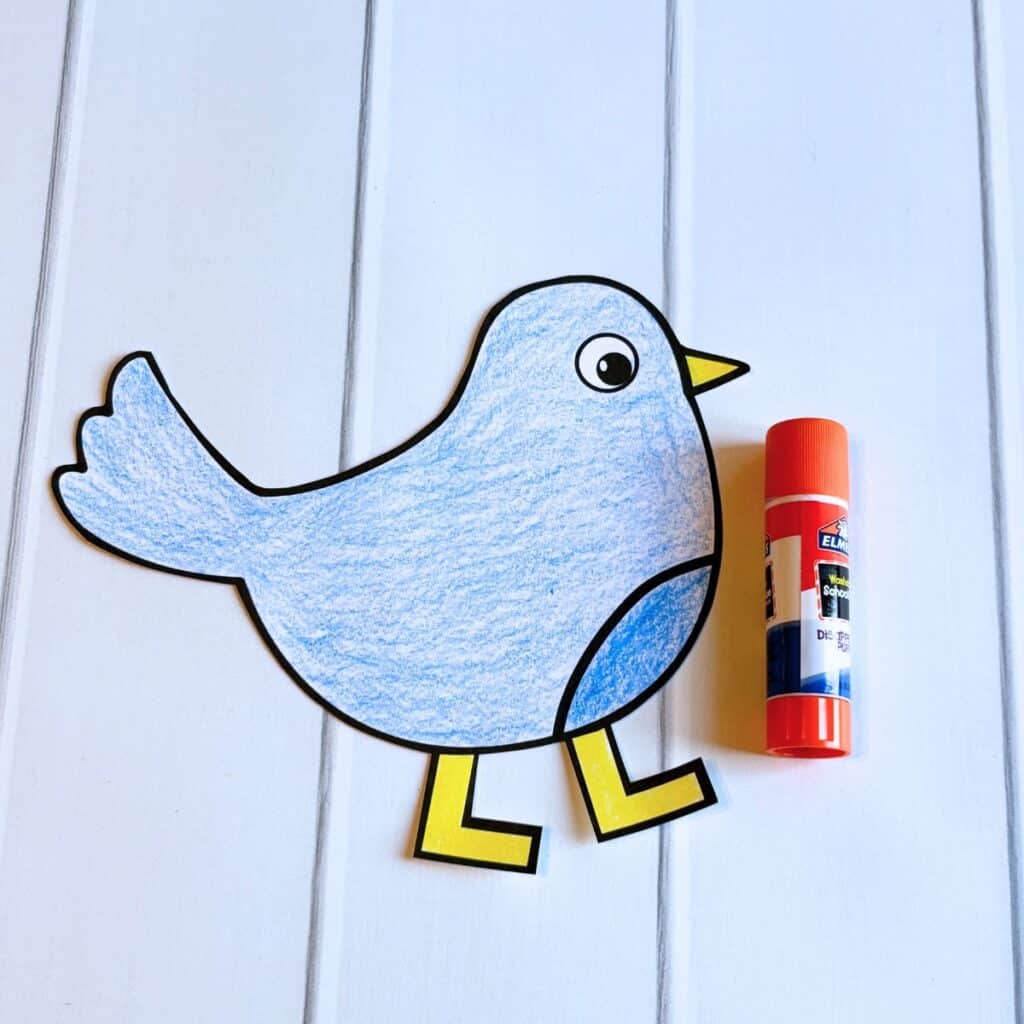 paper bird's legs glued on