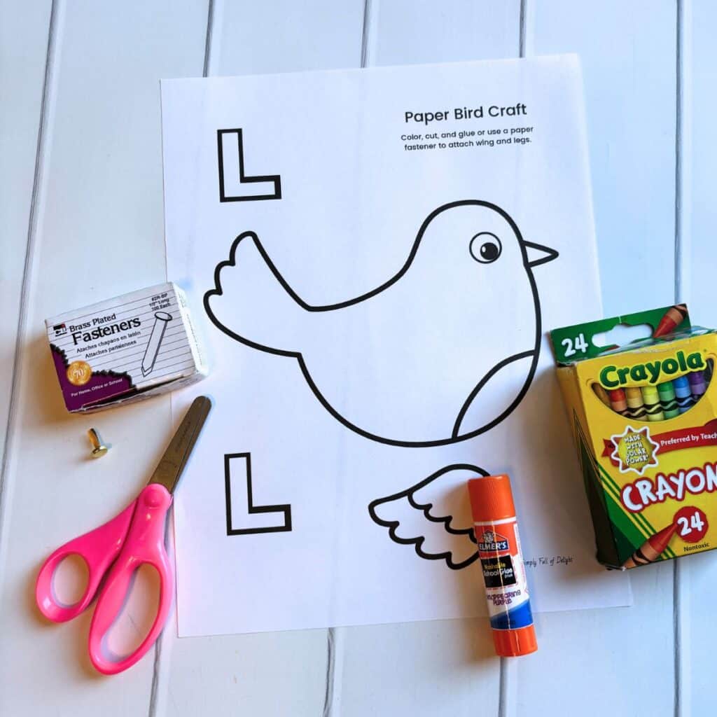 supplies for paper bird - bird template, paper fasteners, crayons, glue stick, scissors