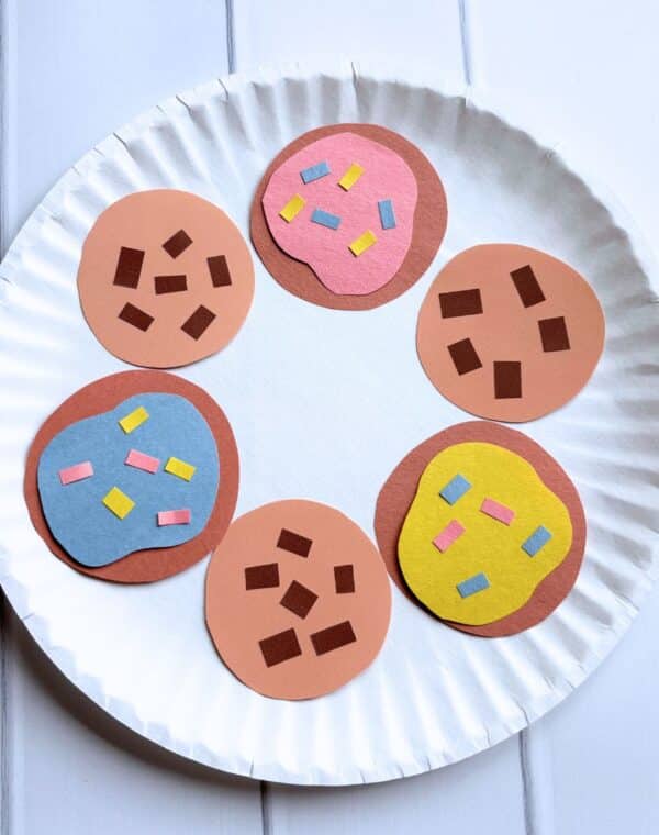 a variety of paper cookies on a paper plate.