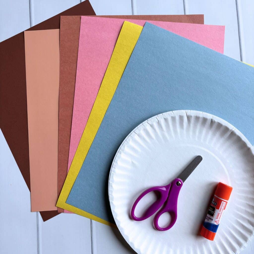 supplies for paper cookie craft - construction paper, scissors, glue stick, paper plate