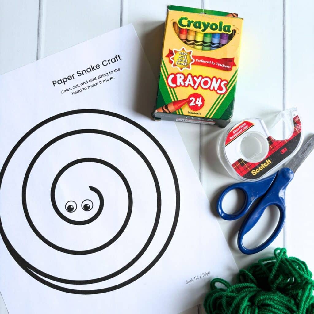 snake craft supplies - snake template, crayons, tape, yarn and scissors