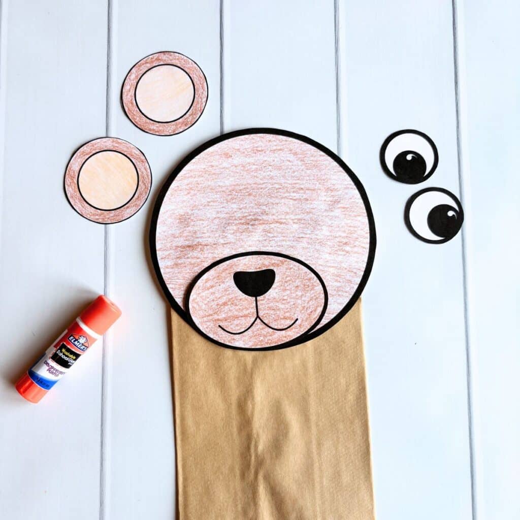 gluing the bear puppet together