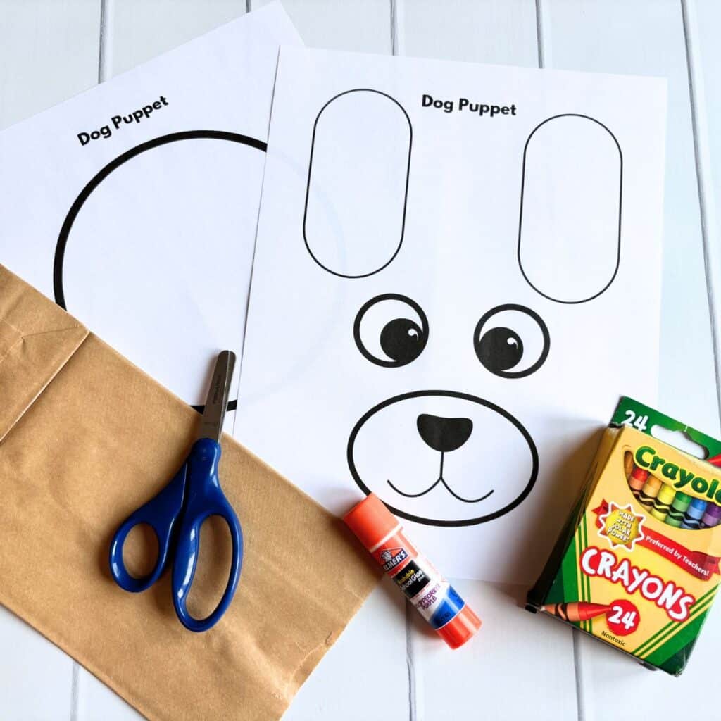dog puppet supplies:  paper bag, dog template, crayons, glue sticks, scissors