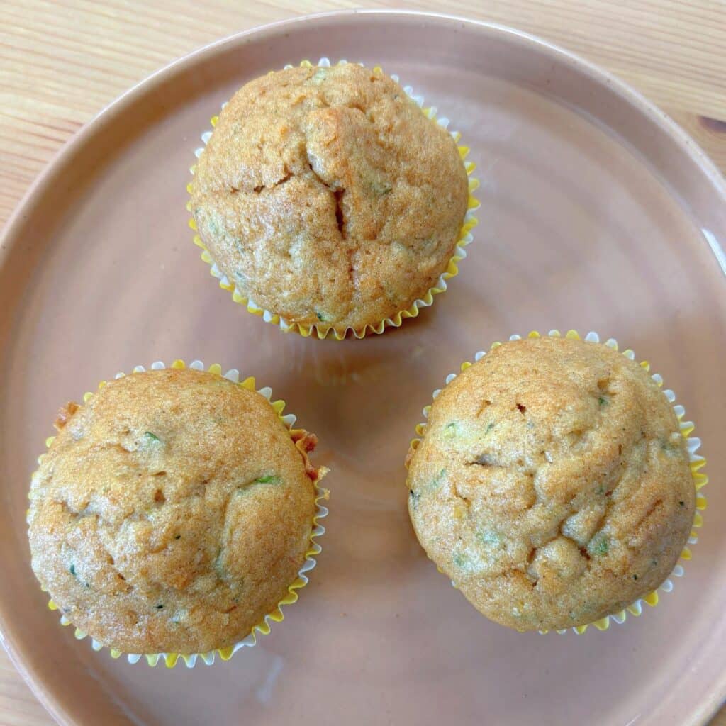 plate with 3 gluten free zucchini muffins