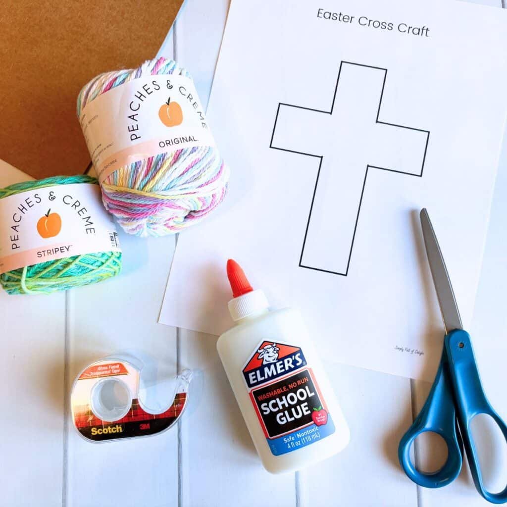 supplies for Easter Cross craft - yarn, scissors, glue, cross template, tape, cardboard